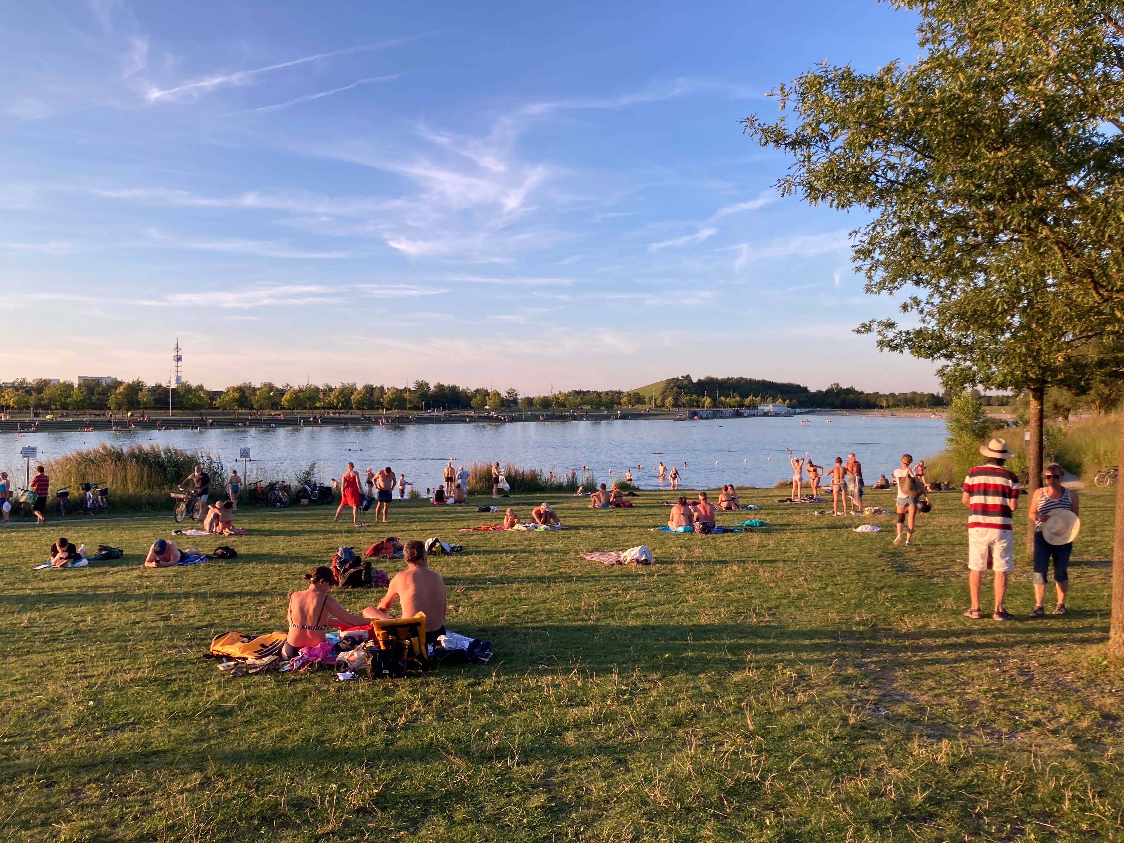 Lake with people around it