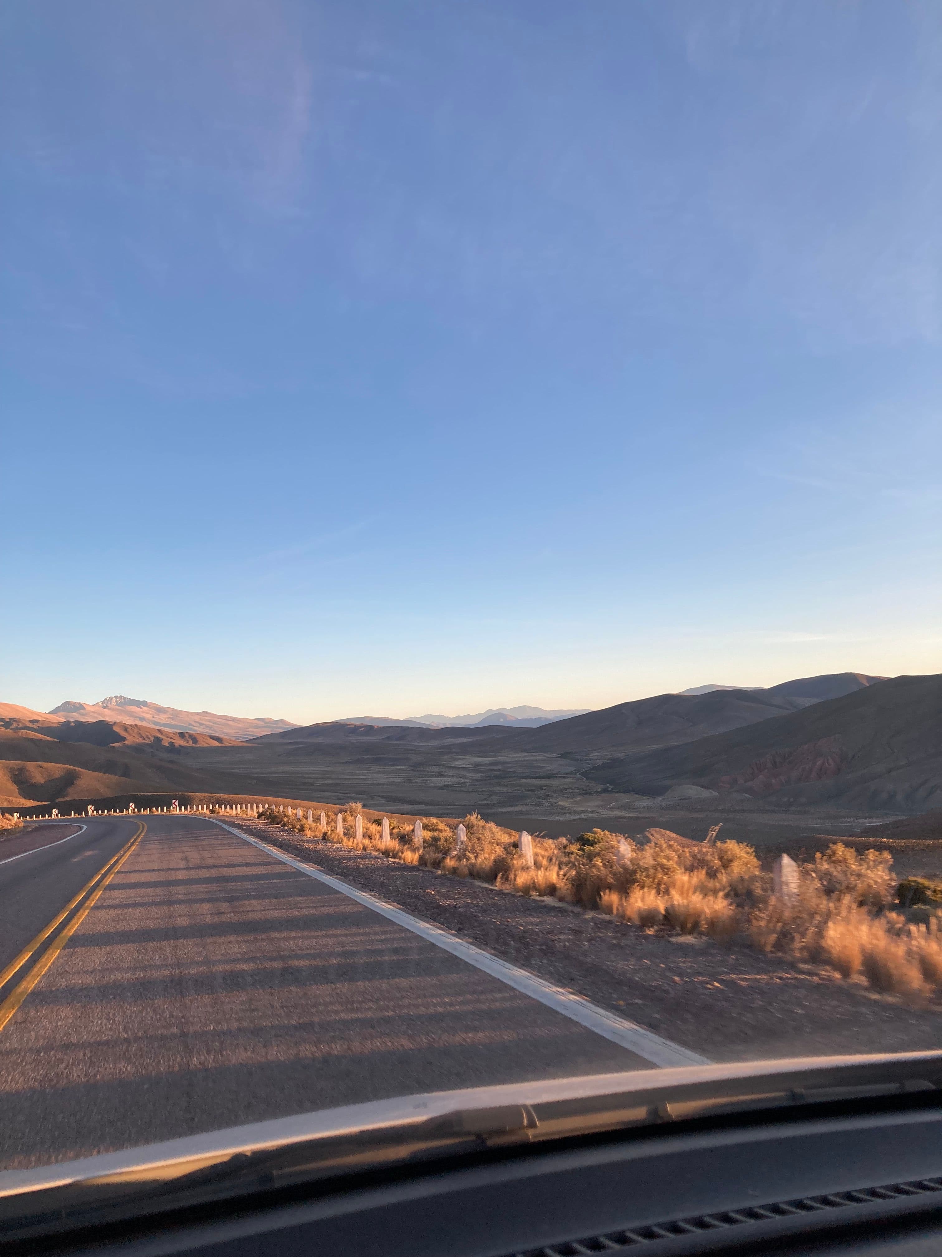 View out of a car onto a road in the Andes