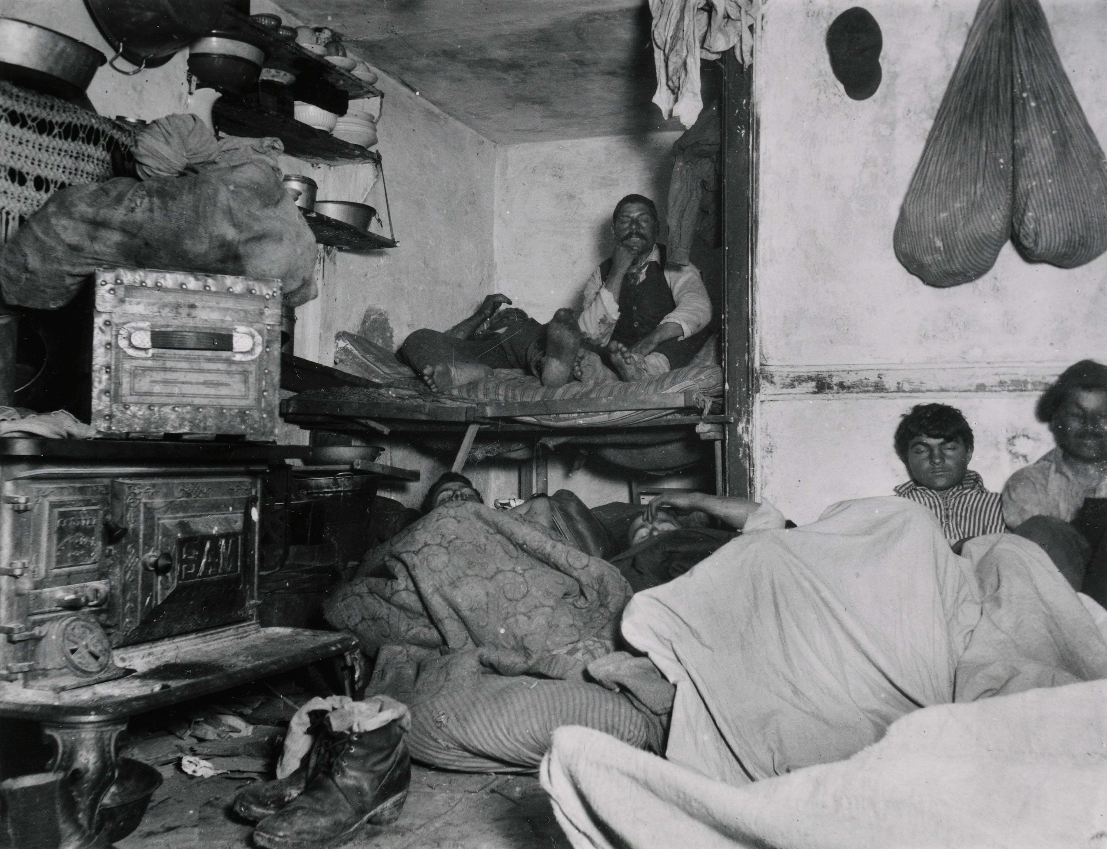 People in their beds in a crowded apartment